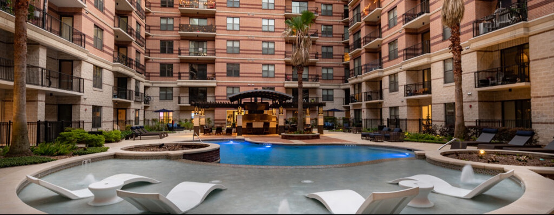 pool showing reclining seating and nearness to property buildings