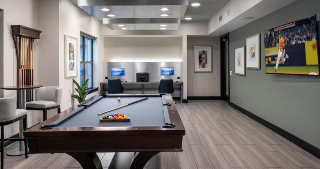 Pool table with workstations in background